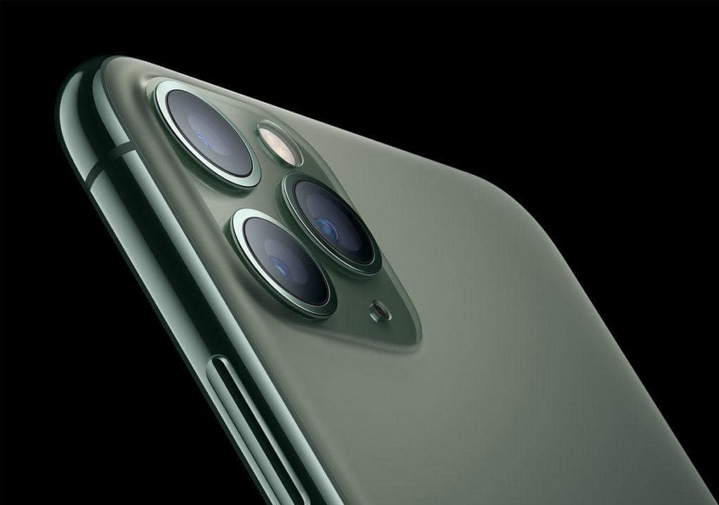 Close-up of iPhone 11 Pro camera lenses showing detailed design.